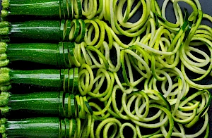 Photograph of Courgettes being spiralized into courgetti