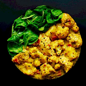 Photograph of a bowl of Keralan Chicken Curry with Spinach
