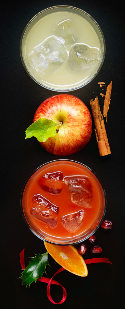 Fresh Christmas Apple Juices with whole apple and cinnamon garnish