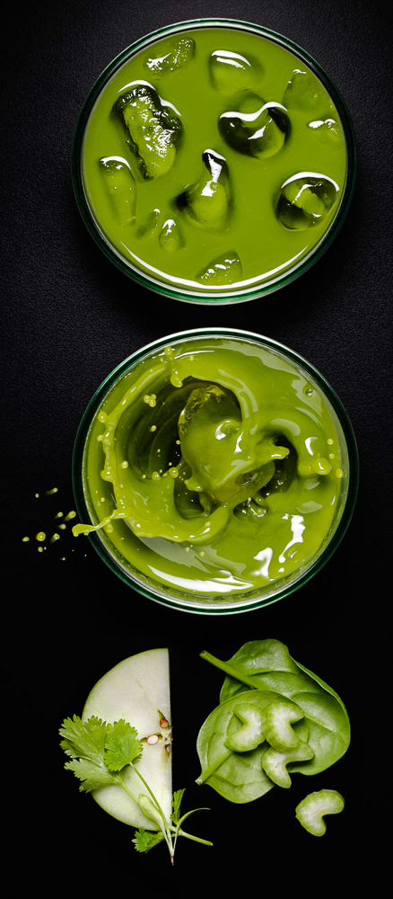 Photograph of apple and spinach juice with splash