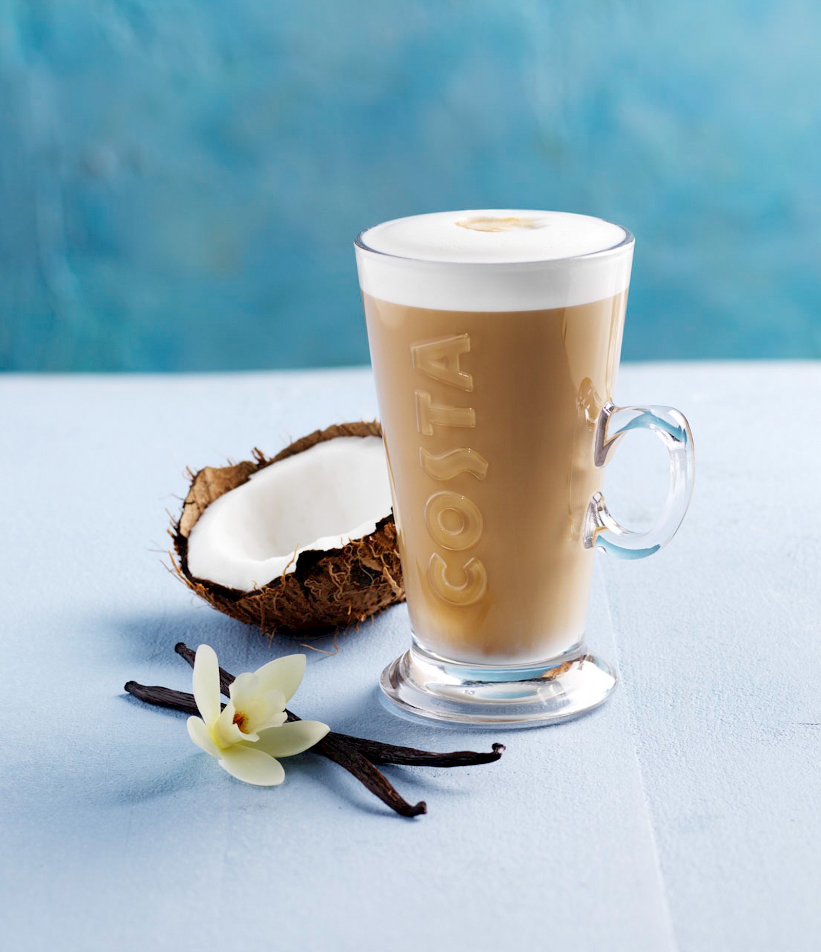 Costa Coconut and Vanilla Latte on Pale Blue Background with Vanilla