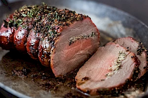 Roasting beef stuffed with herb butter_