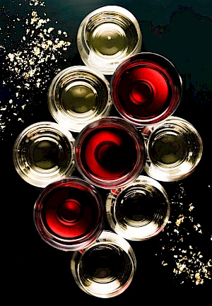 Overhead wine glasses with christmas glitter