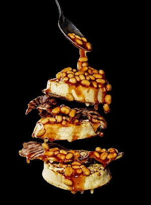 Flying crumpets with bacon and baked beans